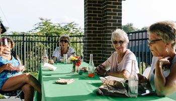 a group of women sitting at a table at Walnut Crossings, Monroeville, PA, 15146
